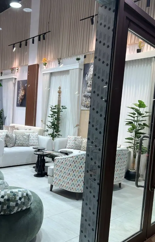 Home-furnishings showroom with sofas, armchairs and curtains